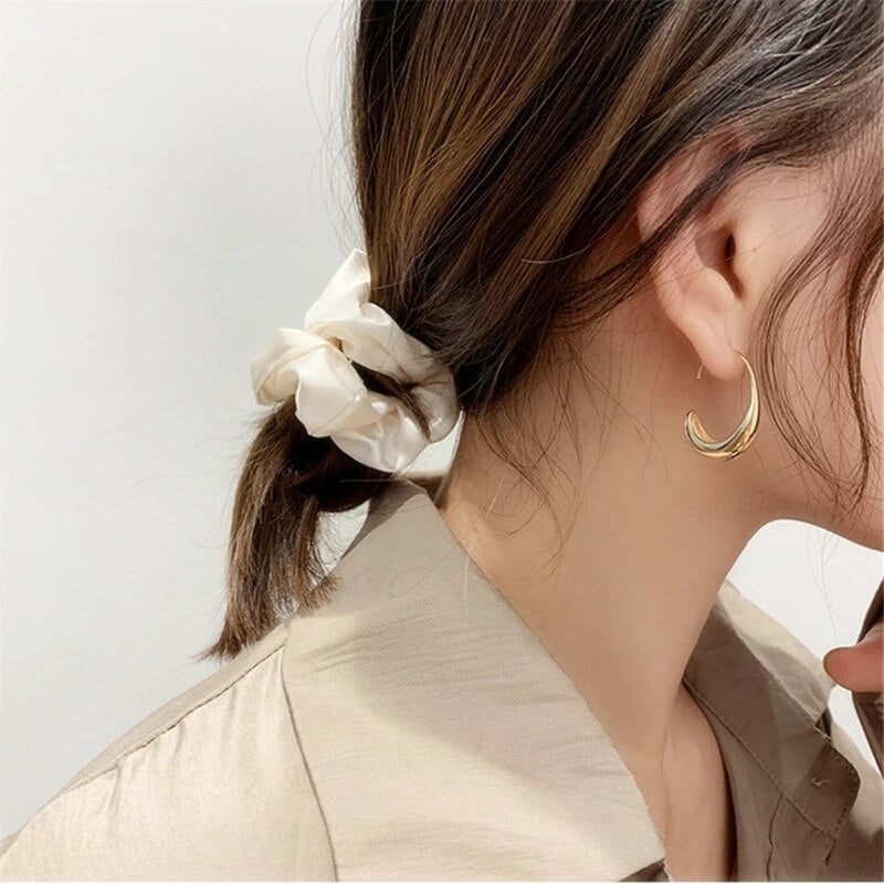 Elegante Ohrringe in Gold und Silber